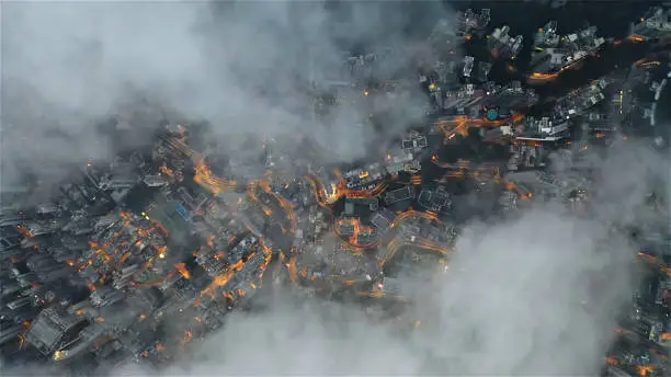 City-like structure partially obscured by clouds